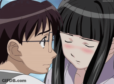 A Man And A Woman Are Looking At Each Other With Animekol.to Written On The Bottom Right GIF