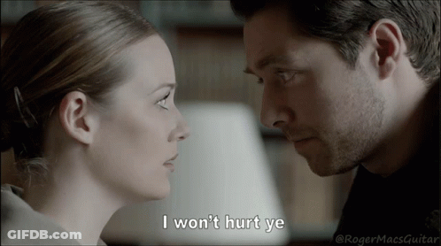 A Man And A Woman Are Looking At Each Other With The Caption I Won 'T Hurt Ye GIF