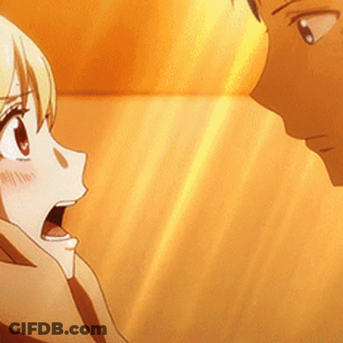 A Man And A Woman Are Looking At Each Other With The Woman Looking Surprised GIF