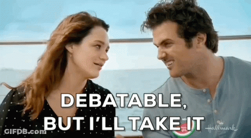 A Man And A Woman Are Looking At Each Other With The Words Debatable But I 'Ll Take It GIF