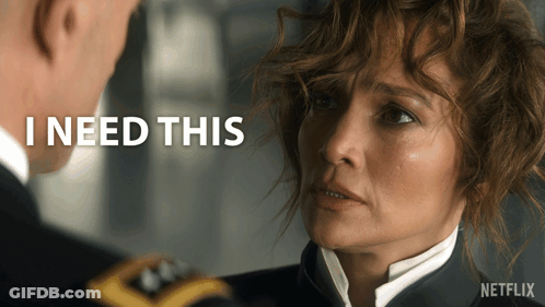 Man And Woman Looking At Each Other With I Need This Behind Them GIF