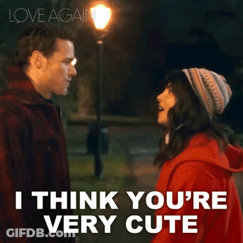 A Man And A Woman Are Looking At Each Other With The Words " I Think You 'Re Very Cute " Below Them GIF
