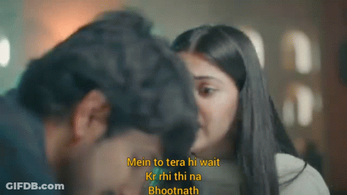 A Man And A Woman Are Looking At Each Other With The Words Mein To Tera Hi Wait On The Bottom GIF