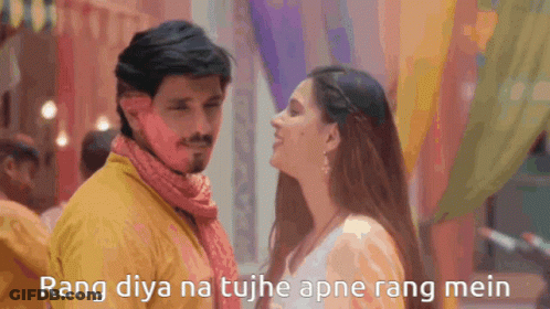A Man And A Woman Are Looking At Each Other With The Words Rang Diya Na Tujh Apne Rang Mein Above Them GIF