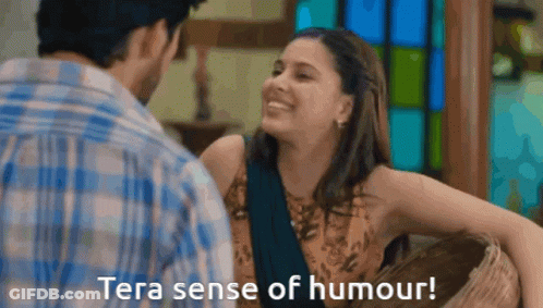 A Man And A Woman Are Looking At Each Other With The Words Tera Sense Of Humour Below Them GIF