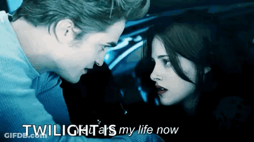 A Man And A Woman Are Looking At Each Other With The Words Twilight 'S My Life Now GIF