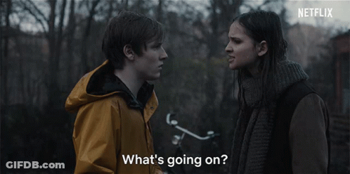 A Man And A Woman Are Looking At Each Other With The Words What 'S Going On GIF
