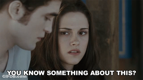 A Man And A Woman Are Looking At Each Other With The Words " You Know Something About This " Below Them GIF