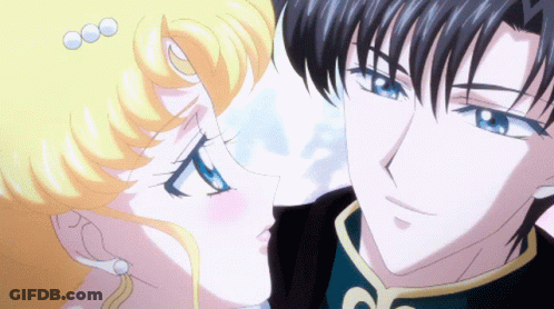 A Man And A Woman Are Looking At Each Other With Their Eyes Closed GIF