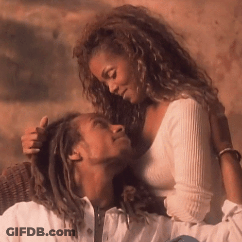 A Man And A Woman Are Looking At Each Other With Their Eyes Closed GIF