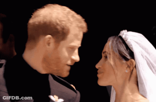 A Man And A Woman Are Looking At Each Other With Their Eyes Closed GIF