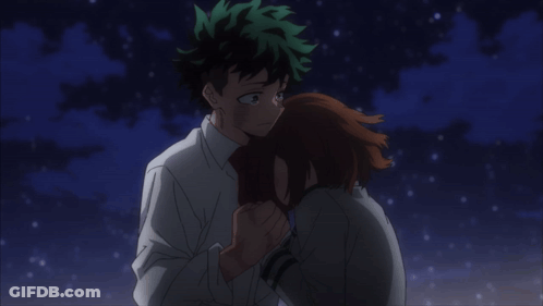A Man And A Woman Are Looking At Each Other With Their Eyes Closed GIF