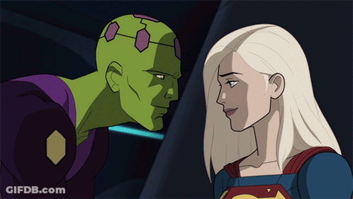 A Man And A Woman Are Looking At Each Other GIF