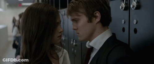 A Man And A Woman Are Looking Into Each Other 'S Eyes GIF