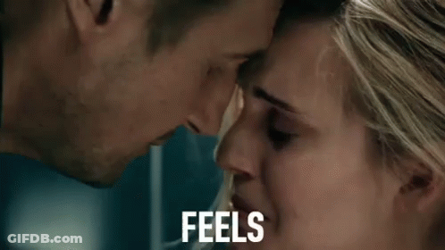 A Man And A Woman Are Looking Into Each Other 'S Eyes And The Woman Is Crying . GIF