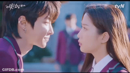 A Man And A Woman Are Looking Into Each Other 'S Eyes In A Korean Drama . GIF