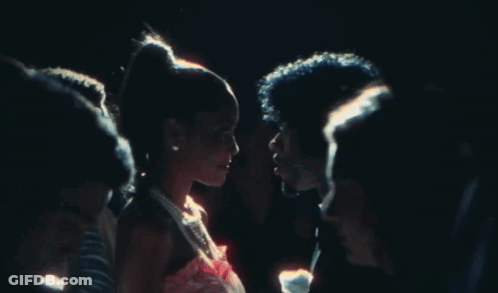 A Man And A Woman Are Looking Into Each Other 'S Eyes GIF