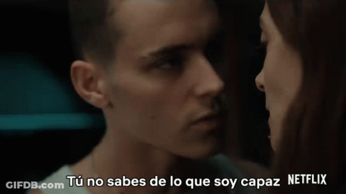 A Man And A Woman Are Looking Into Each Other 'S Eyes With Netflix Written In The Upper Right Corner GIF