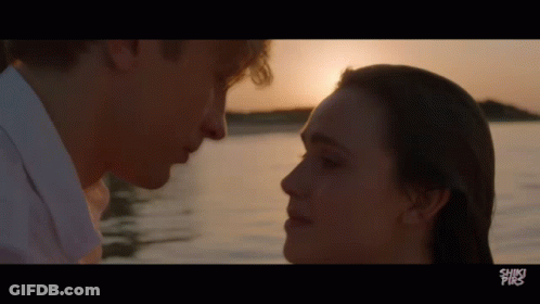 A Man And A Woman Are Looking Into Each Other 'S Eyes With The Words Shiki Pix On The Bottom Of The Screen GIF