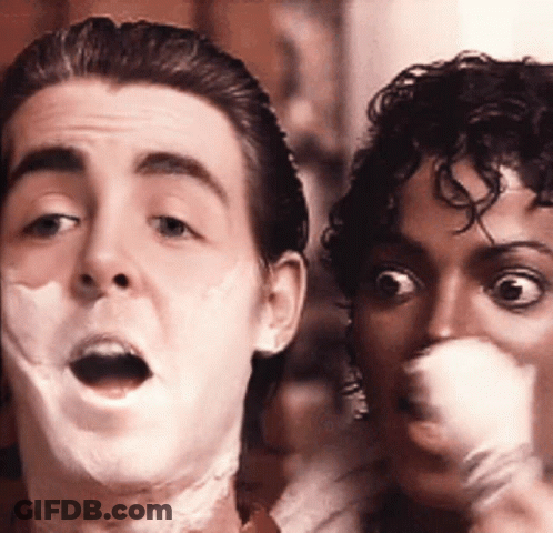 A Man And A Woman Are Making Funny Faces GIF