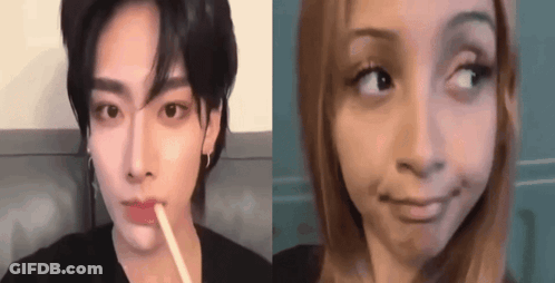 A Man And A Woman Are Making Funny Faces . GIF
