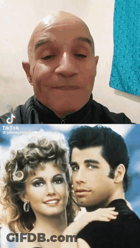 A Man And A Woman Are Next To Each Other GIF