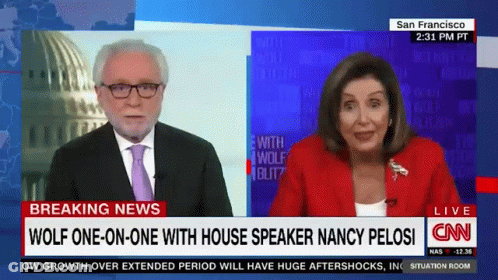A Man And A Woman Are On Cnn 'S Breaking News Channel GIF