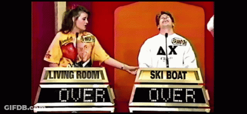 A Man And A Woman Are Playing A Game Called Living Room Over Ski Boat GIF