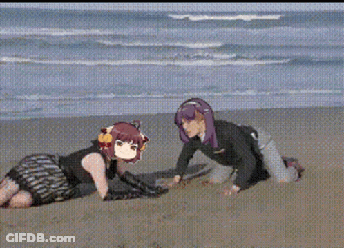 A Man And A Woman Are Playing In The Sand On The Beach GIF