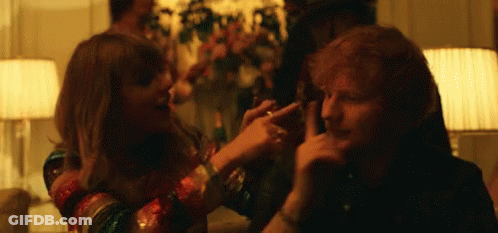 A Man And A Woman Are Playing With Each Other In A Living Room . GIF