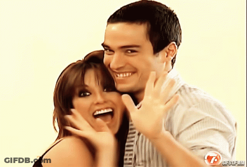 A Man And A Woman Are Posing For A Photo With The Number 7 On The Bottom GIF
