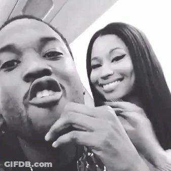 A Man And A Woman Are Posing For A Picture Together And Smiling In A Black And White Photo . GIF