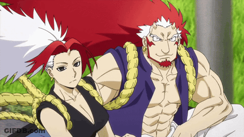 A Man And A Woman Are Posing For A Picture Together GIF