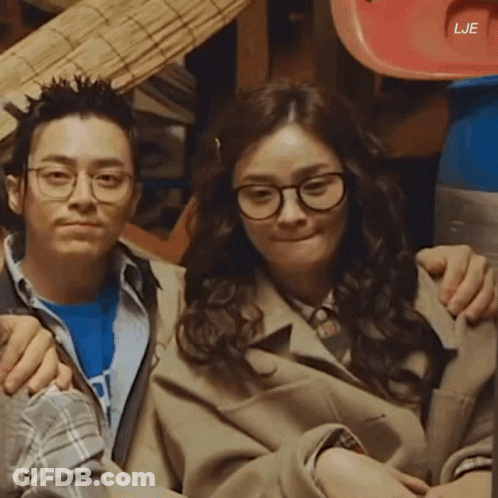 A Man And A Woman Are Posing For A Picture With The Letters Lje On The Bottom GIF