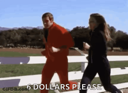 A Man And A Woman Are Running On A Track And The Man Is Wearing A Red Suit And The Woman Is Wearing Black Pants . GIF