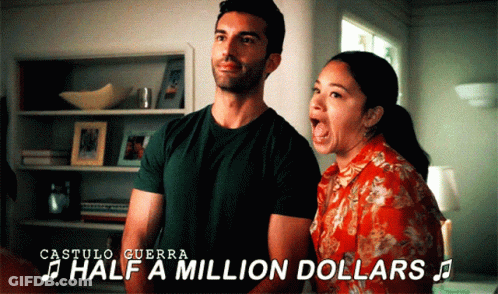 A Man And A Woman Are Singing Half A Million Dollars In A Room GIF