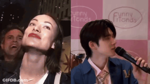 A Man And A Woman Are Singing Into Microphones In Front Of A Funny Friends Sign GIF