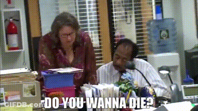 A Man And A Woman Are Sitting At A Desk In An Office With The Words `` Do You Wanna Die ? '' GIF