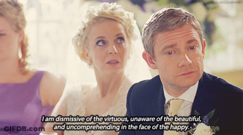 A Man And A Woman Are Sitting At A Table And The Man Is Saying " I Am Dismissive Of The Virtuous GIF