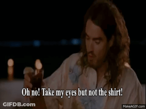 A Man And A Woman Are Sitting At A Table And The Woman Is Saying Oh No Take My Eyes But Not The Shirt GIF