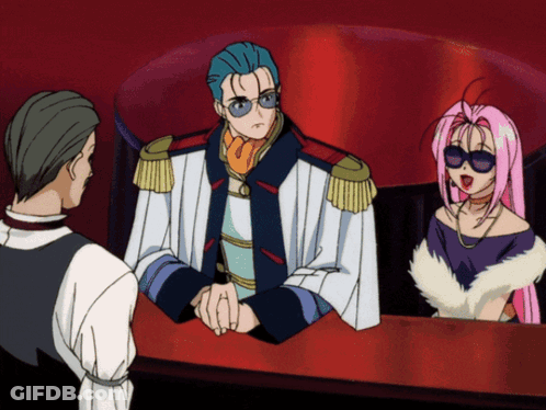 A Man And A Woman Are Sitting At A Table In A Cartoon Scene GIF