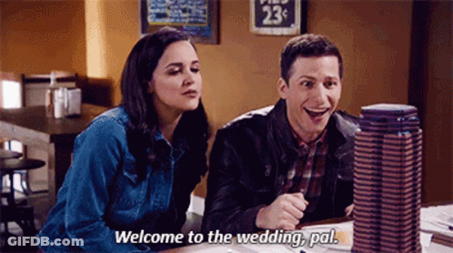 A Man And A Woman Are Sitting At A Table In A Restaurant . The Woman Is Saying `` Welcome To The Wedding , Pal '' GIF