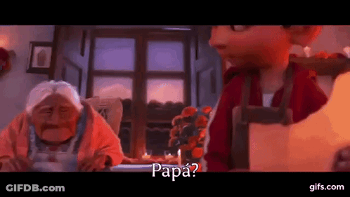 A Man And A Woman Are Sitting At A Table In A Room And The Man Is Asking The Woman If She Is Papa . GIF
