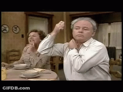 Man And Woman Sitting At Table GIF
