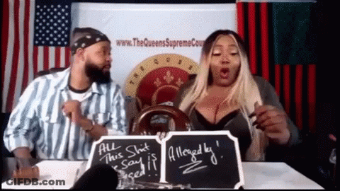 A Man And A Woman Are Sitting At A Table With A Sign That Says " All This Shit Said Is Alleged By " GIF