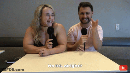 A Man And A Woman Are Sitting At A Table With Microphones And One Of Them Says No Bs Alright GIF