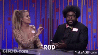 A Man And A Woman Are Sitting At A Table With The Word Rod Written On The Table GIF