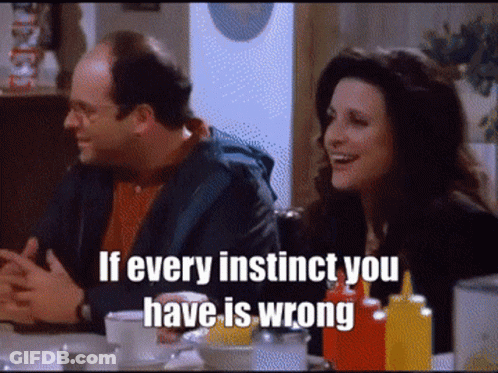 A Man And A Woman Are Sitting At A Table With The Words If Every Instinct You Have Is Wrong On The Screen GIF