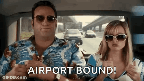 A Man And A Woman Are Sitting In A Car And The Woman Is Giving A Thumbs Up . GIF