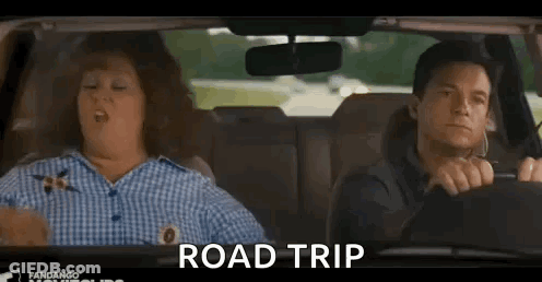 A Man And A Woman Are Sitting In A Car And The Woman Is Yawning . GIF